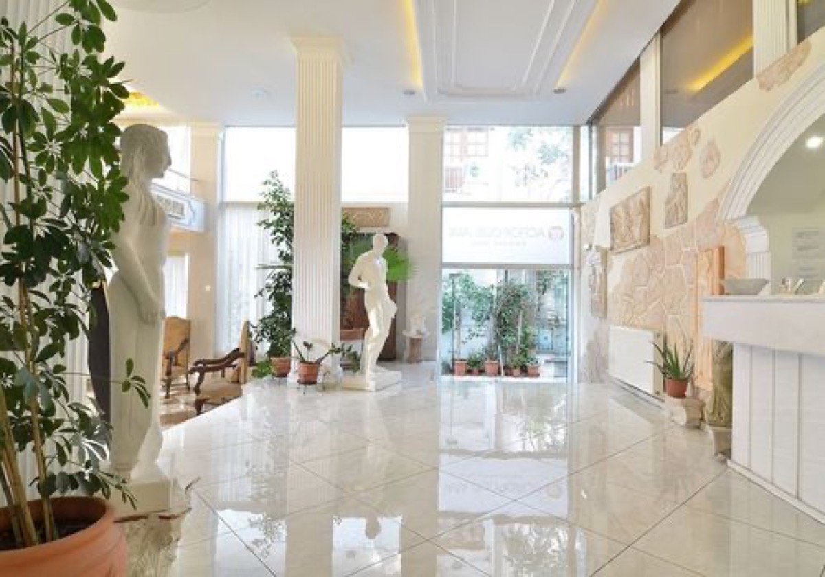 Bright hotel lobby with columns